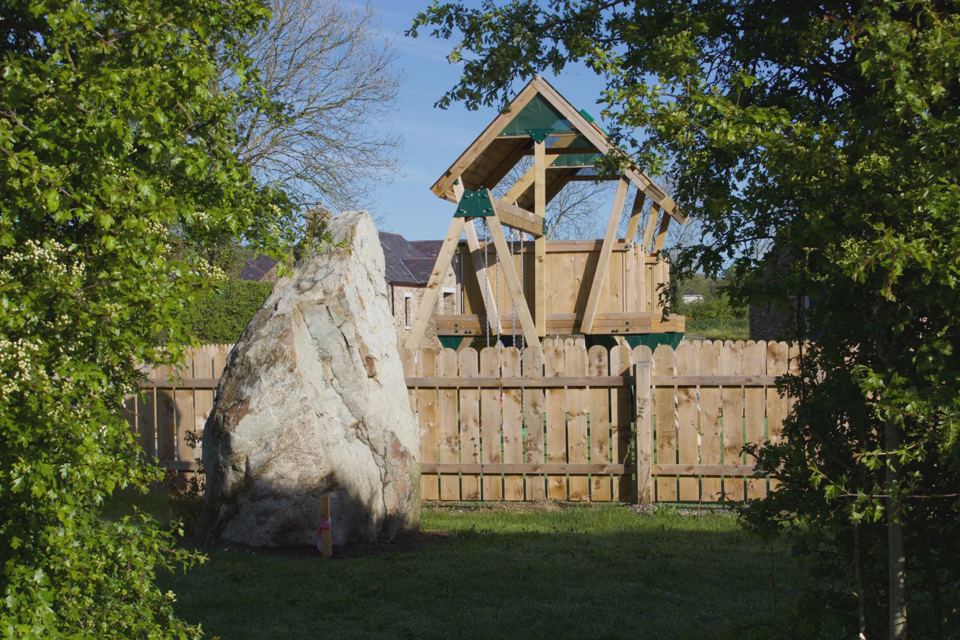Play frame and standing stone