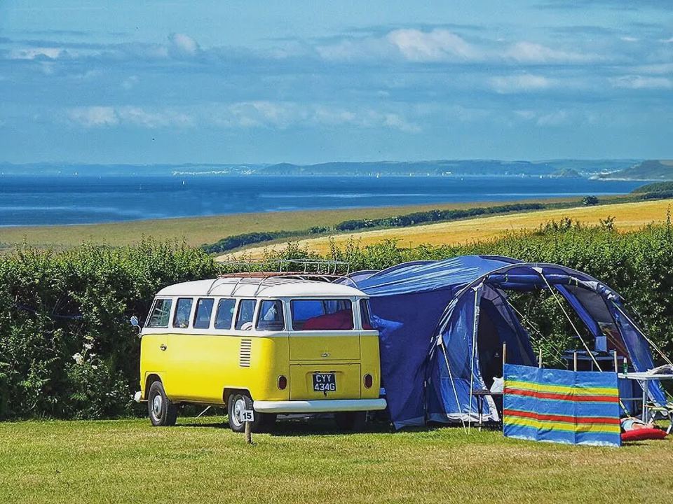 Campervan and tent with sea view