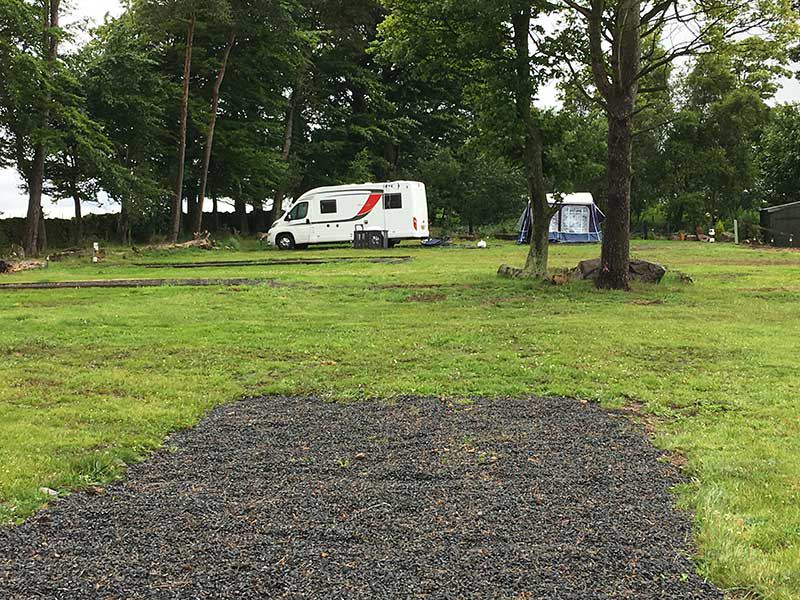 Gravel standing beside the grass