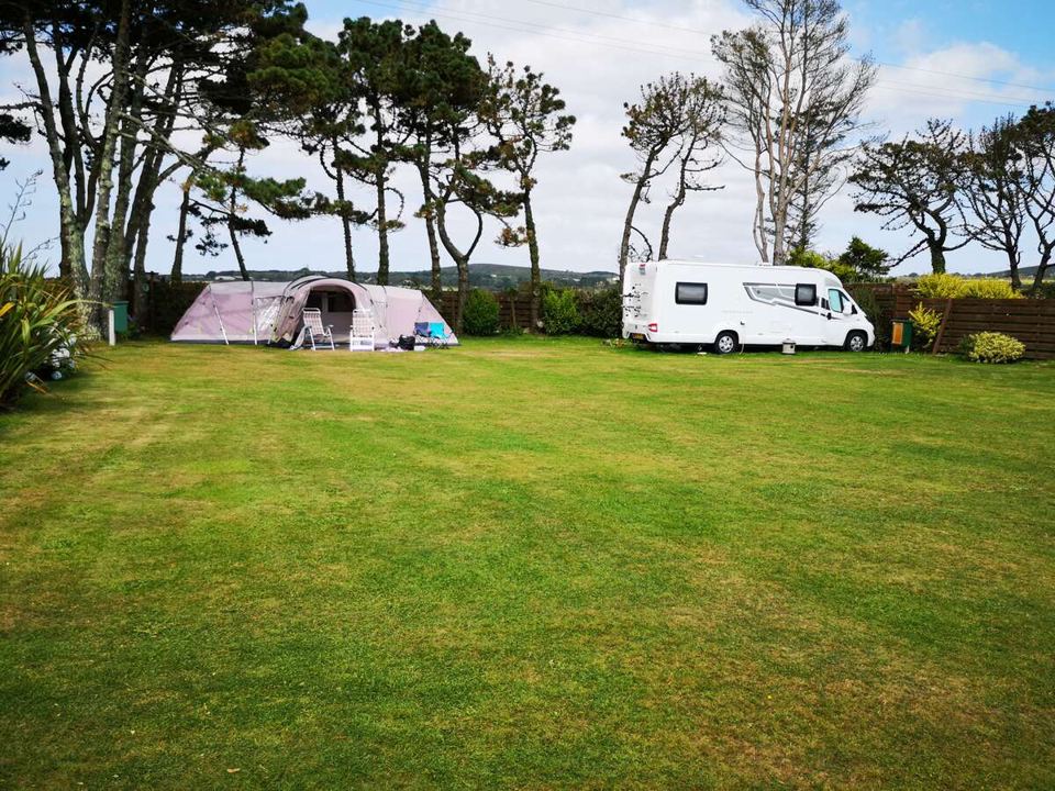 Motorhome and awning on the field