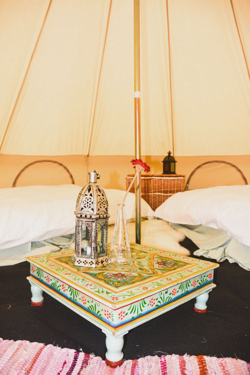 Inside a bell tent with two beds