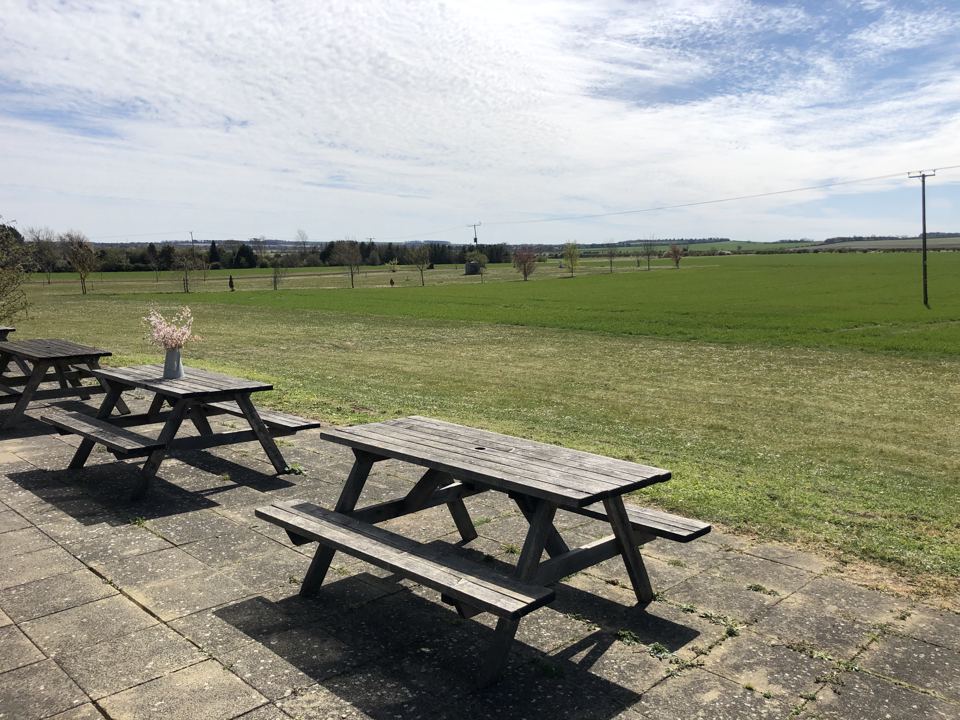 Picnic tables looking over fields