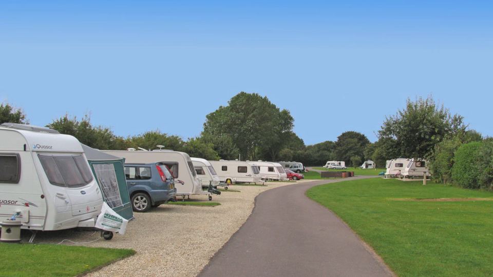 Hardstanding pitches by the path