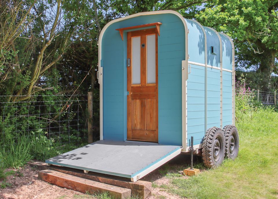 Blue shepherd's hut exterior