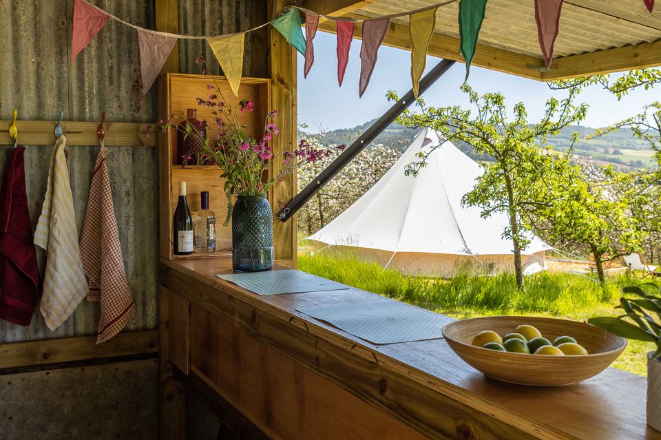 Outdoor bar counter with tent behind
