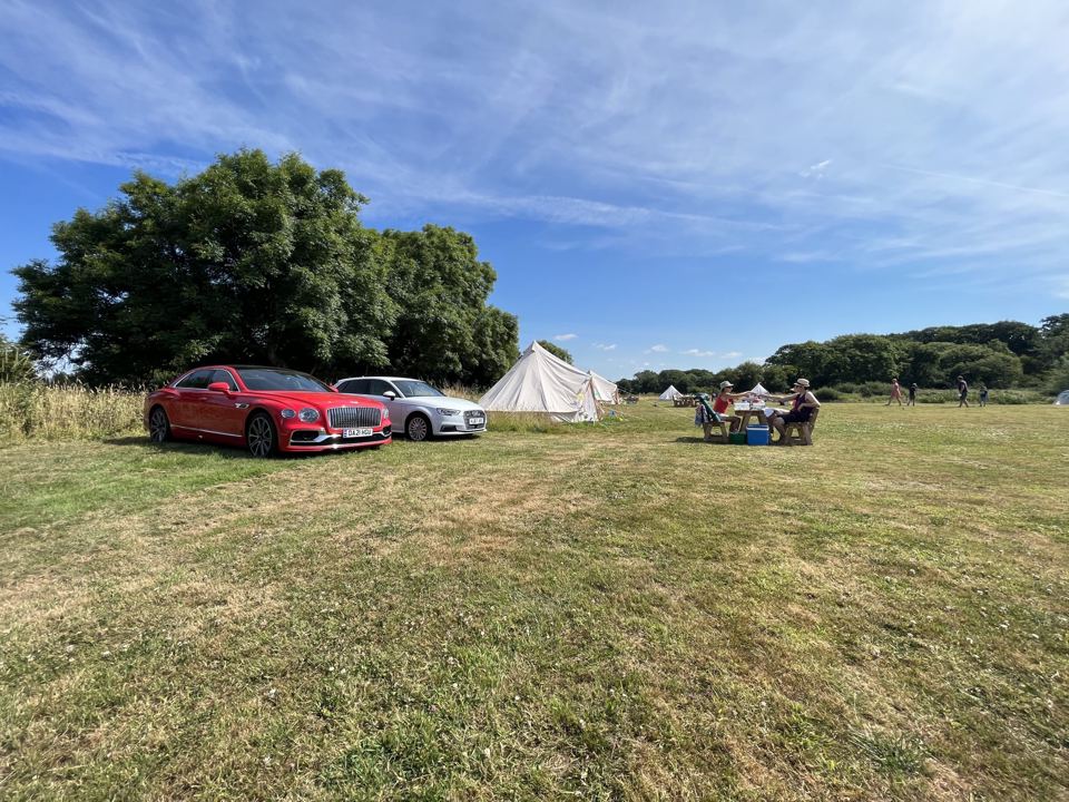 Pitches with cars parked alongside