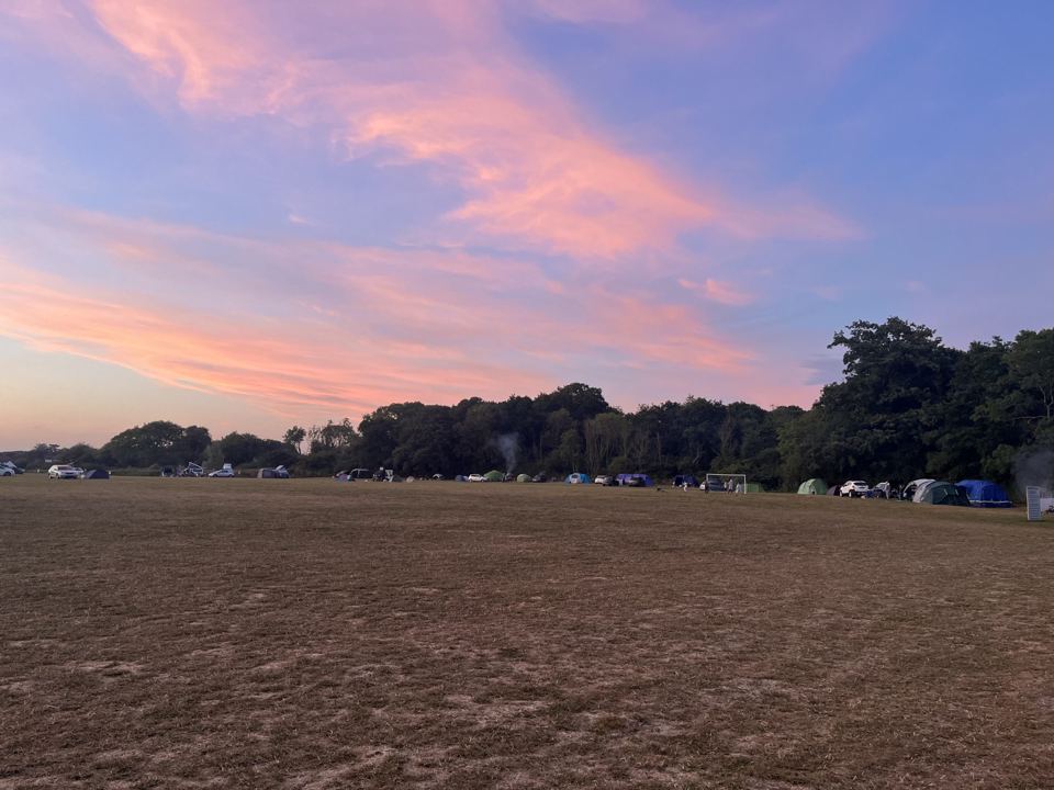 Camping field at sunset