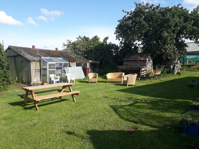 Picnic bench and farm buildings