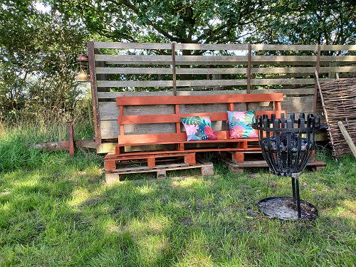Seating by a fire basket