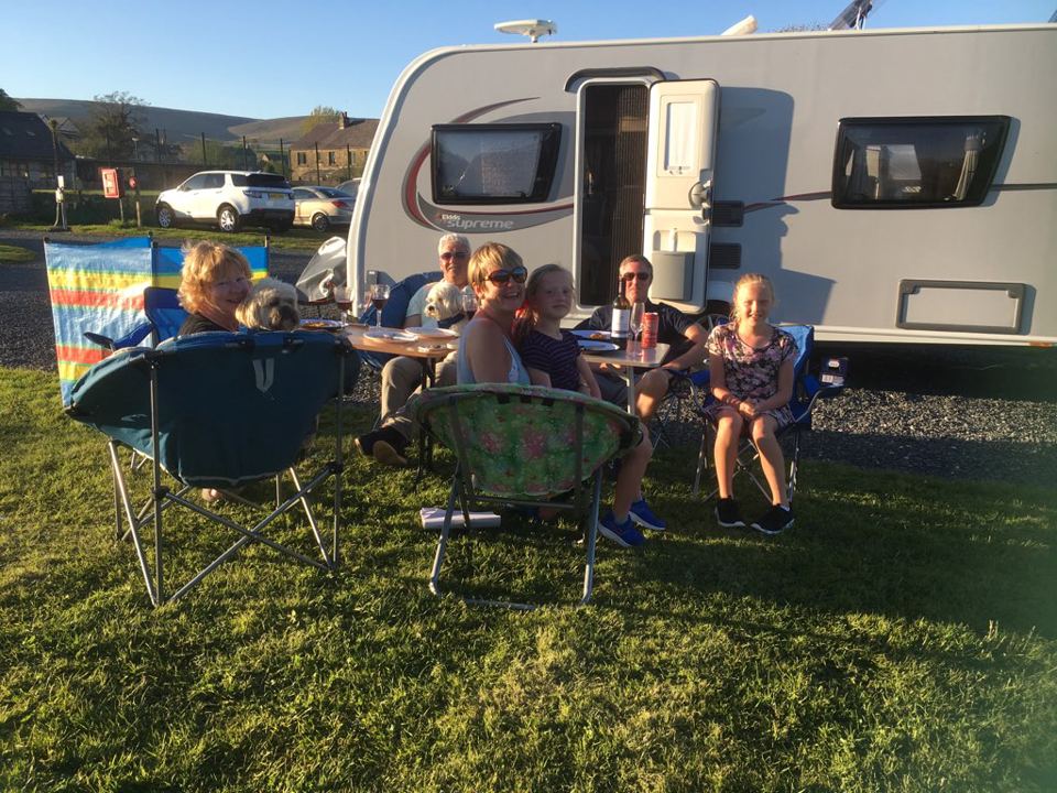 Relaxing outside a caravan