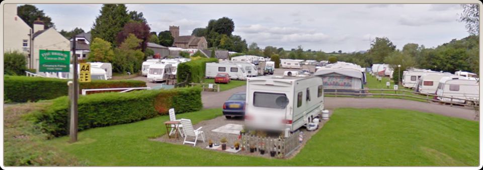 Grass touring pitches by the hedge