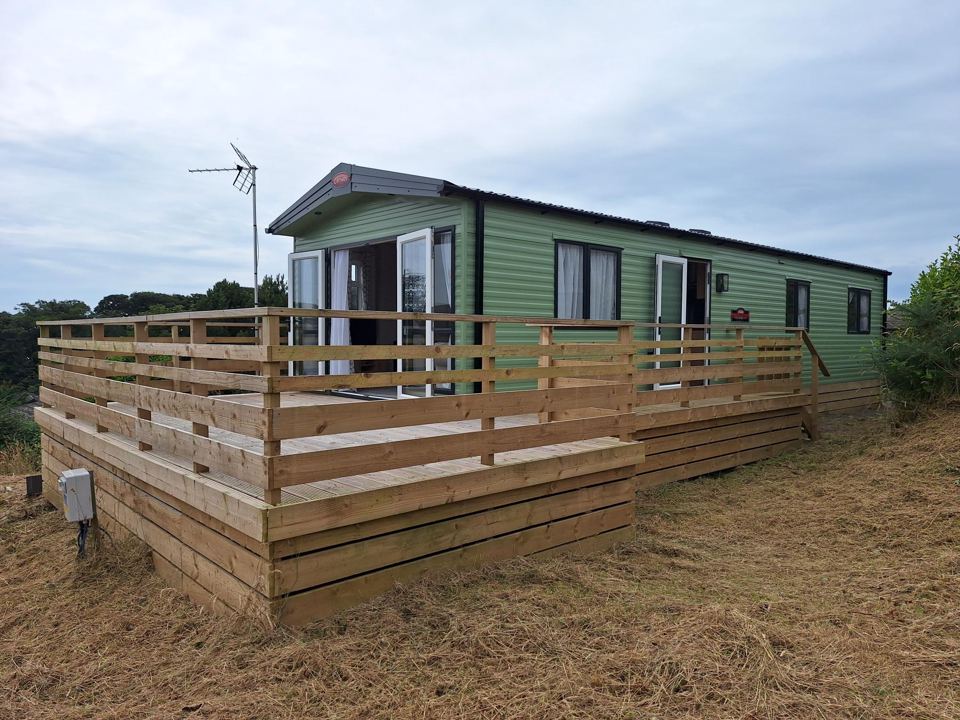Caravan with raised decking