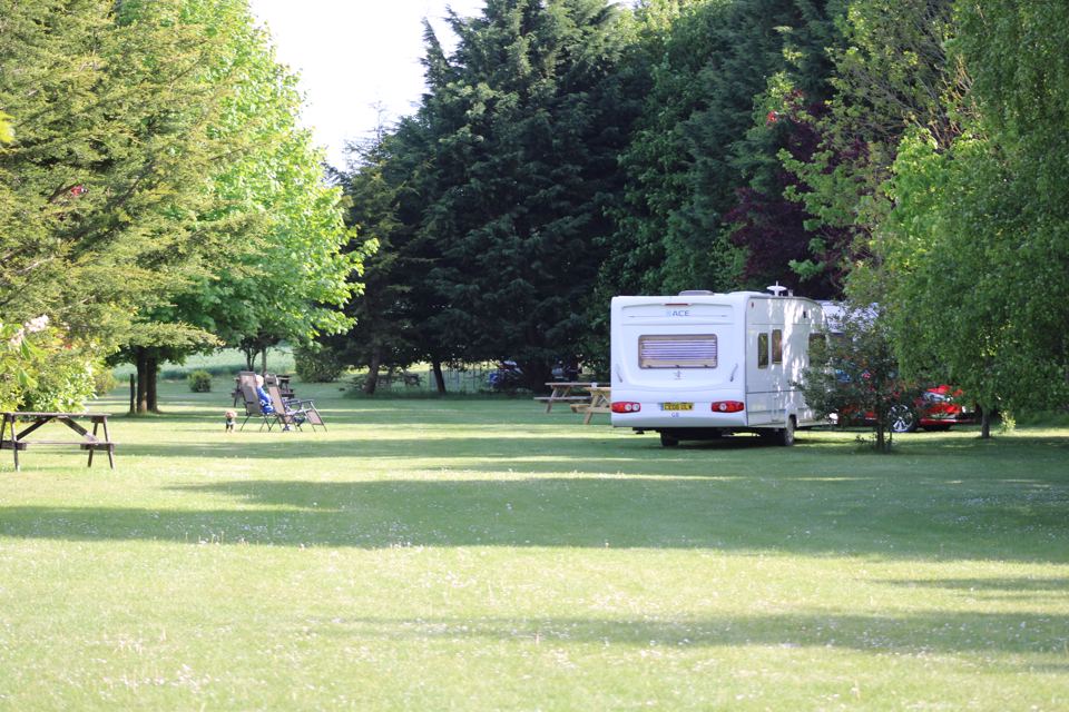 Touring caravan on the field