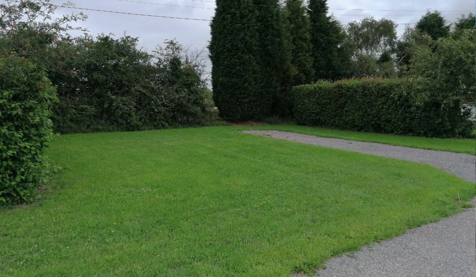 Hedged grass pitch
