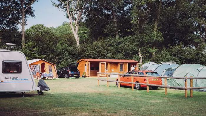 Tents and caravans among trees