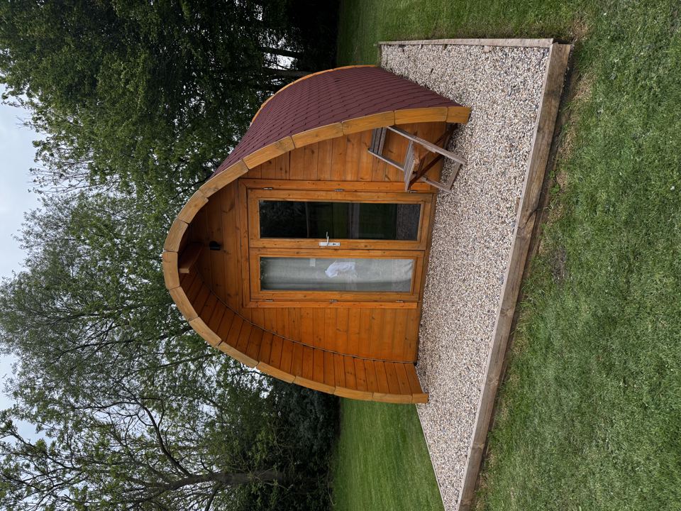 Wooden pod on gravel base