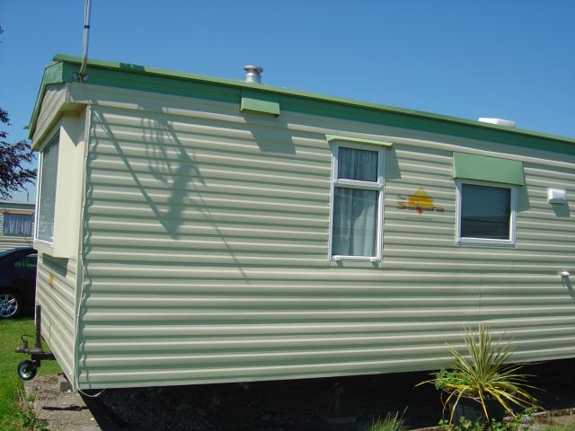 Green and cream caravan