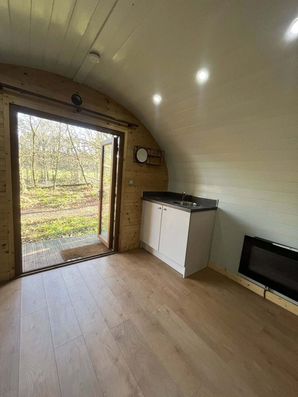Pod interior with window and TV