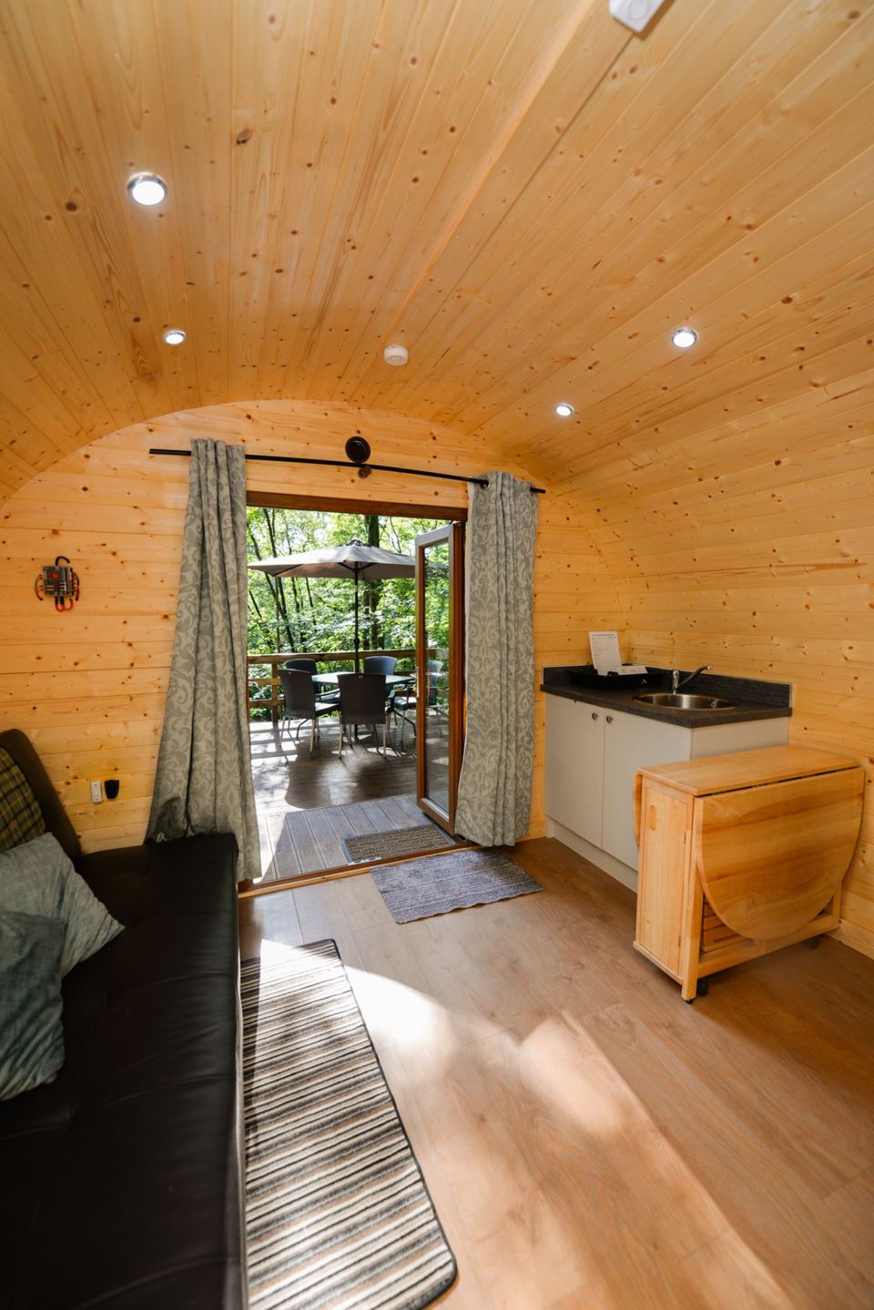 Inside the pod with bed and kitchen