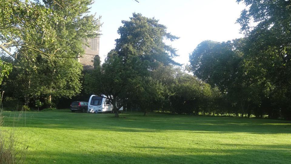 Van among the orchard trees
