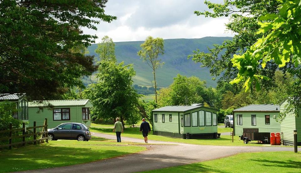 Static caravans among trees