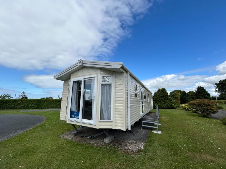 Static caravan on grass