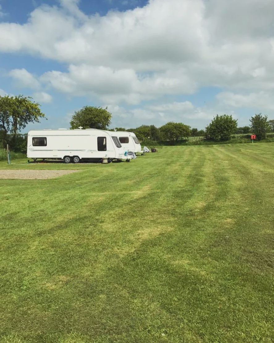 Caravans on mown grass