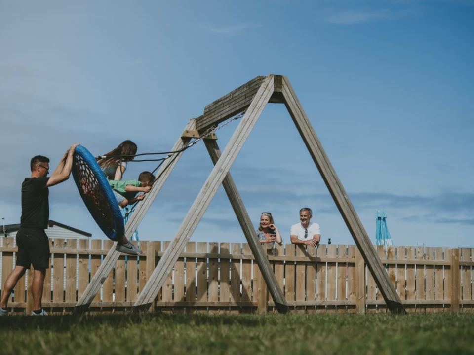 Play equipment with swings
