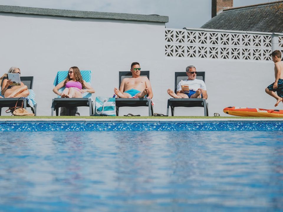 Outdoor pool with loungers