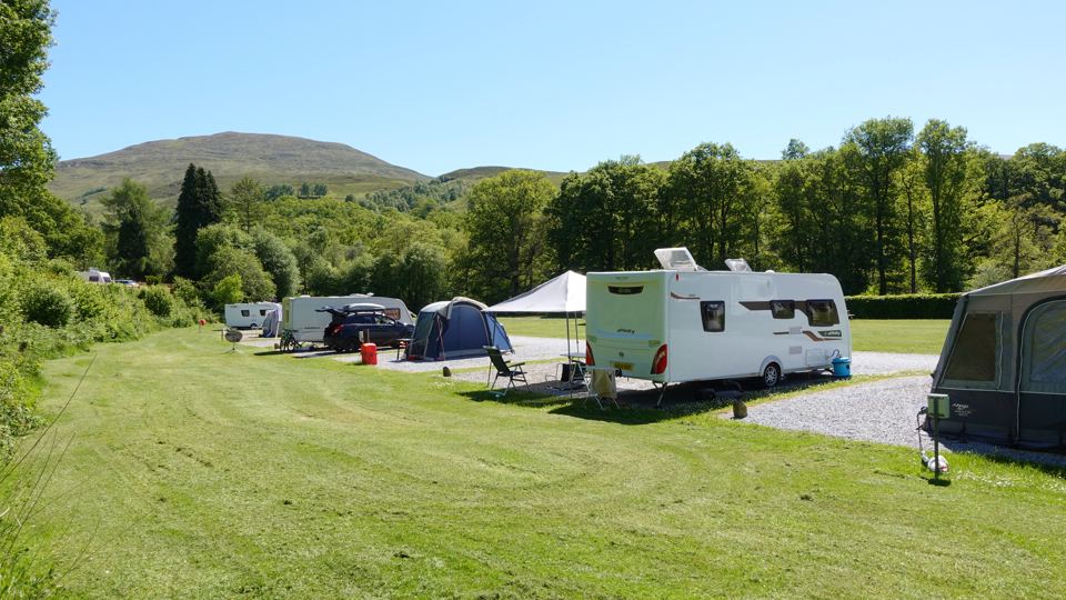Caravans and tents on the grass