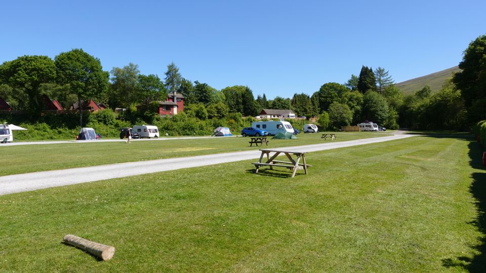 Grass pitches with a picnic table