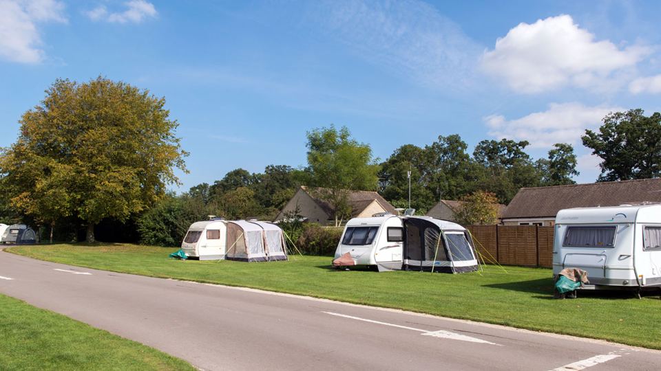 Tents and caravans on grass