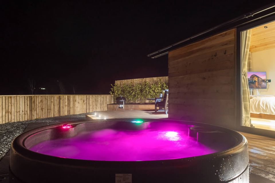 Hot tub by the pod at night