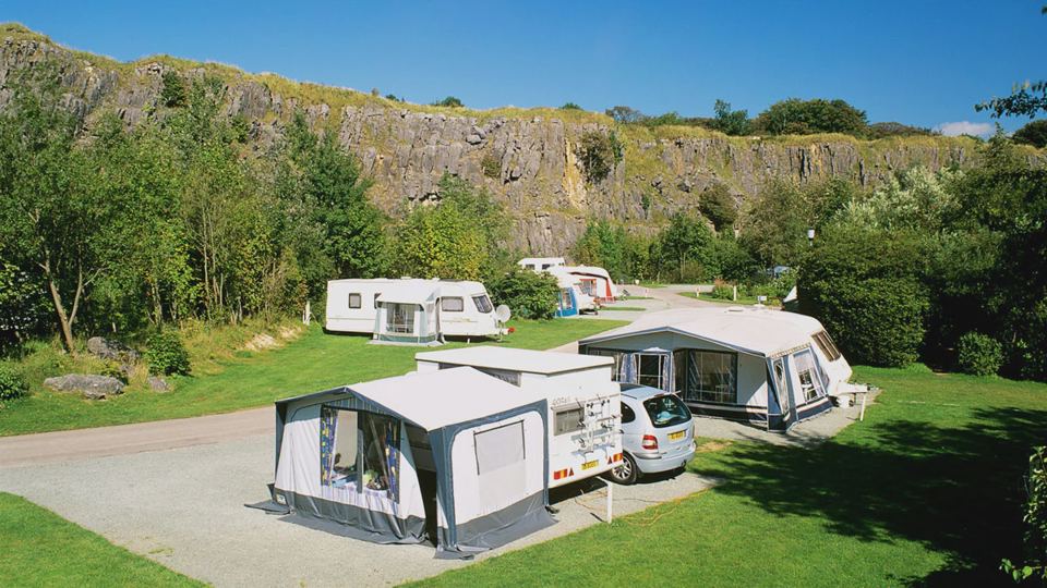 Caravans below the rock face