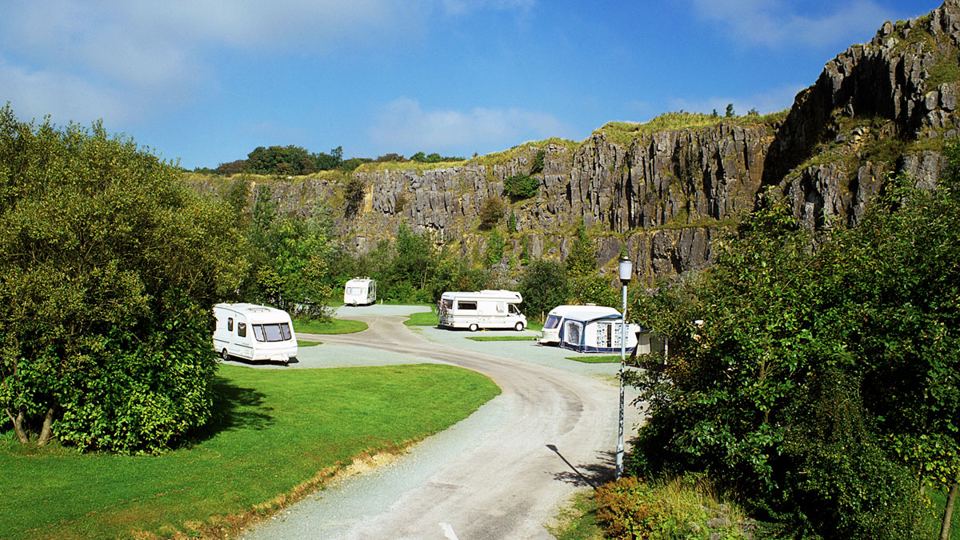 Site road beneath the crags