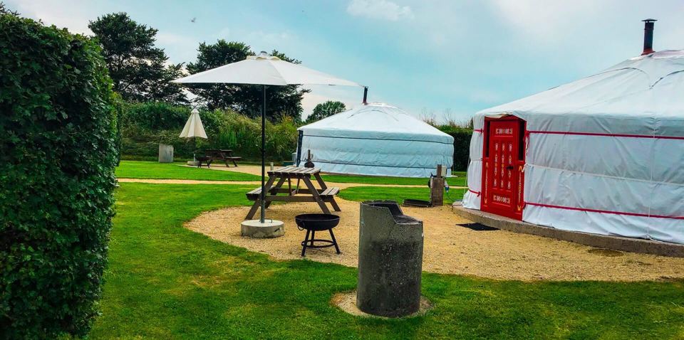Yurts with firepits and picnic tables