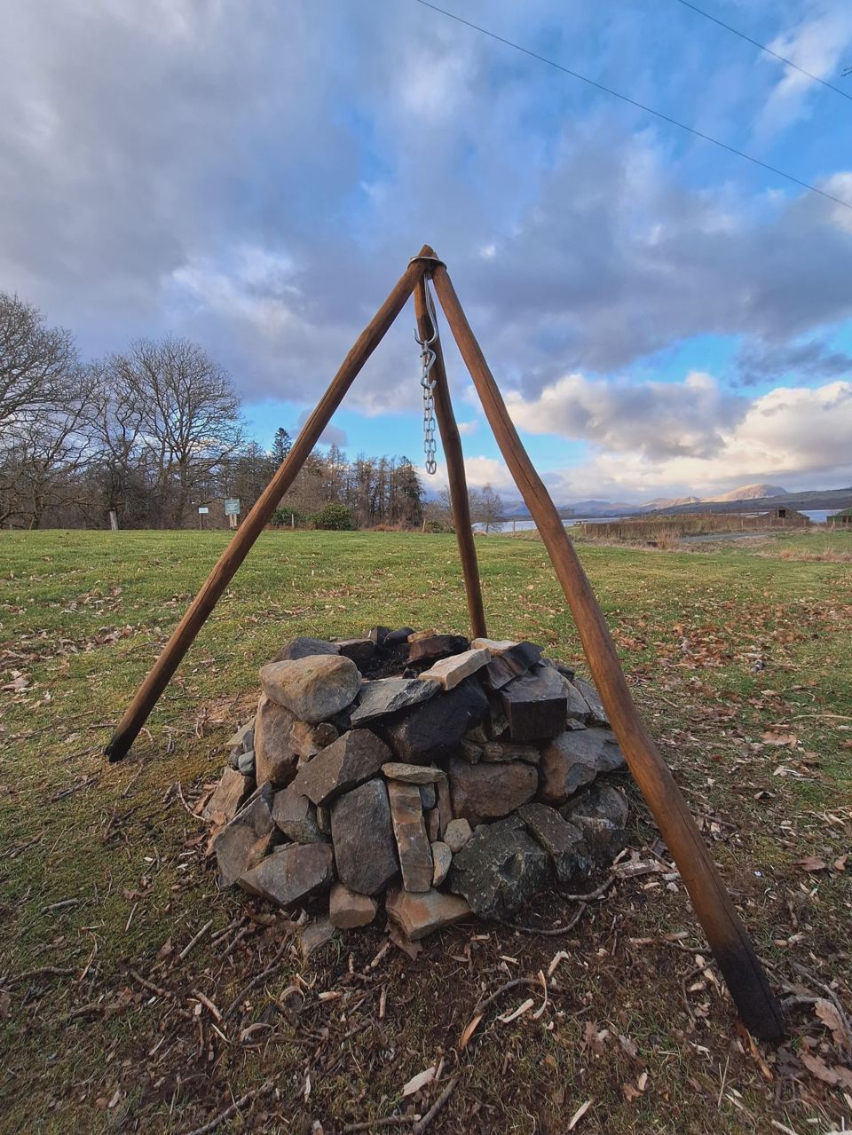 Fire pit with cooking tripod