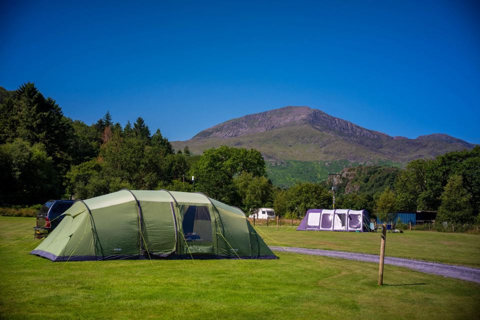 Family tent below the mountains