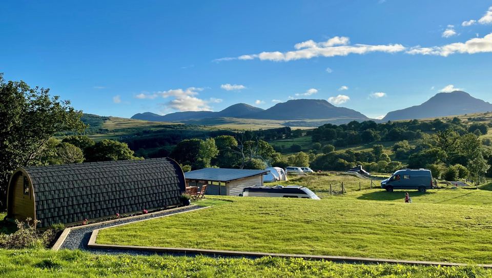 Pod and field below the mountains