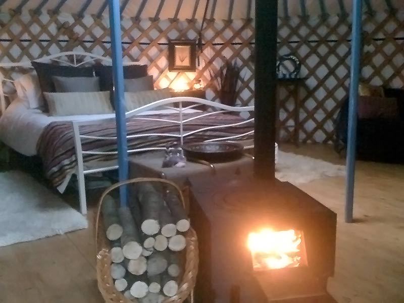 Bed beside the log burner