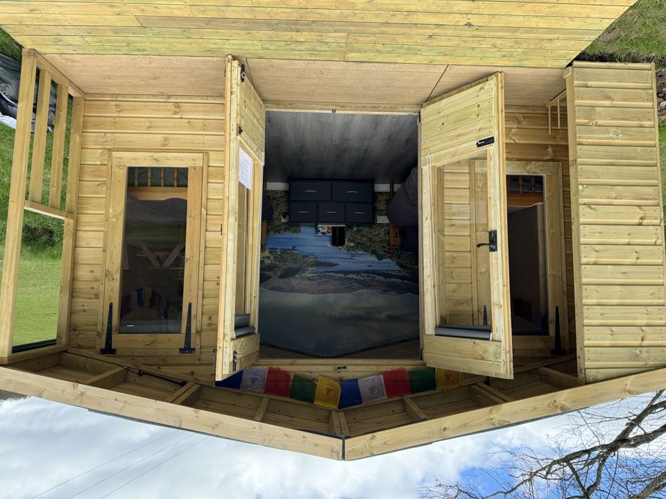 Wooden cabin with open doors