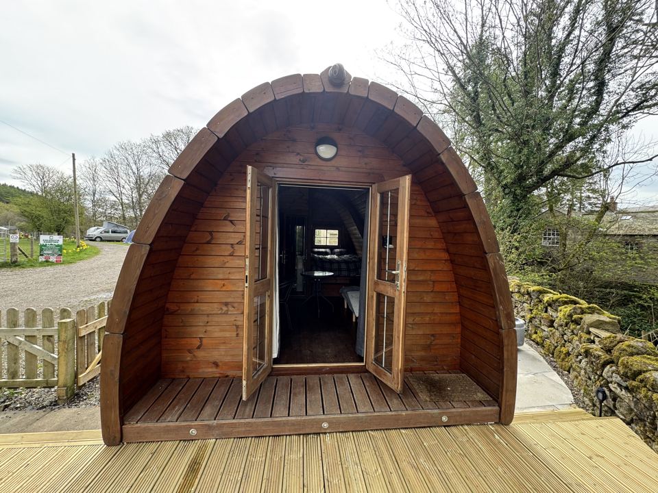 Pod with decking and open door
