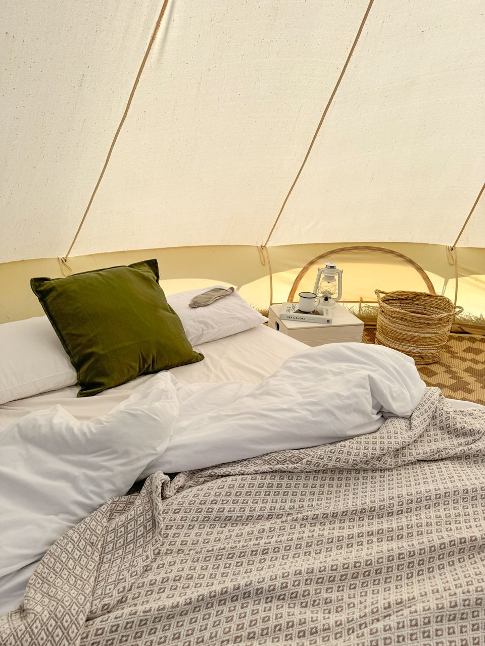 Bell tent bed with woven basket