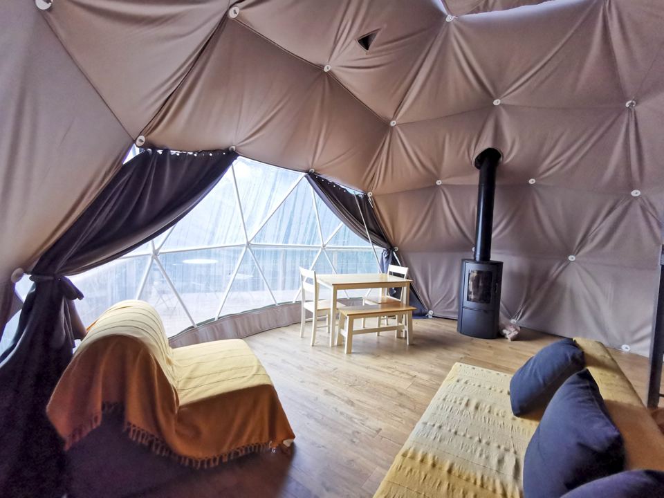 Inside a dome with woodburner