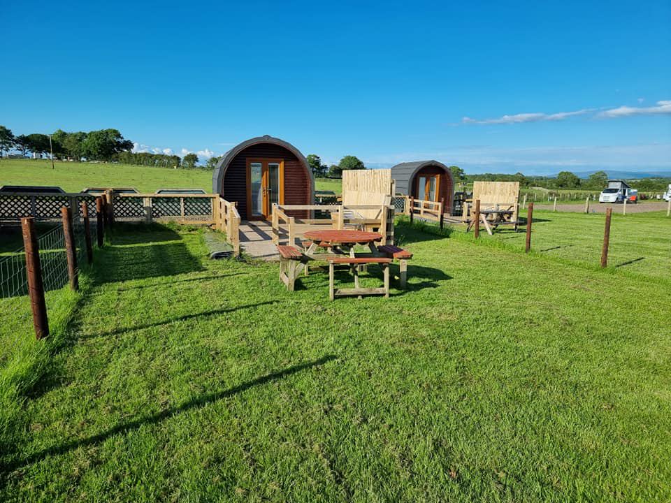 Pods with picnic tables in the field