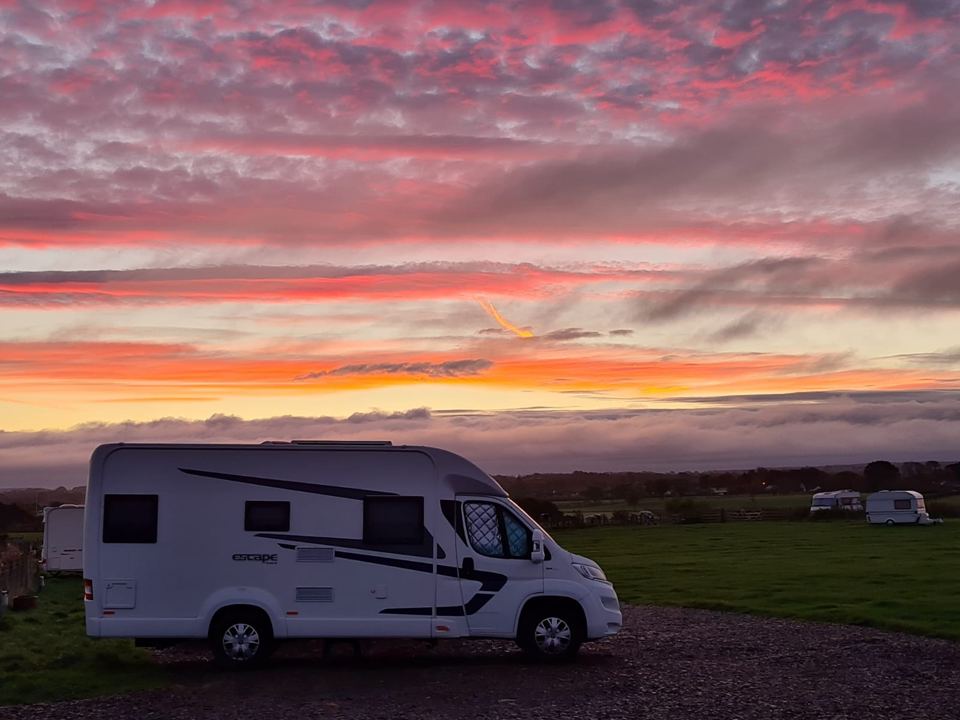 Motorhome under a red sunset