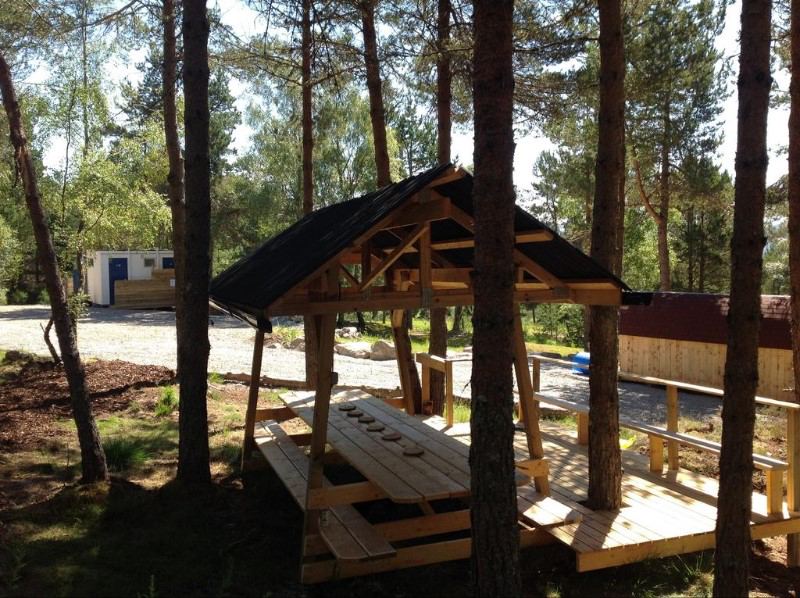 Communal shelter and picnic tables