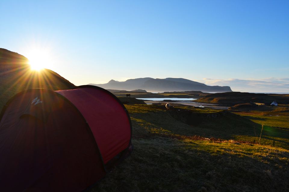 Tent at sunrise over the sea