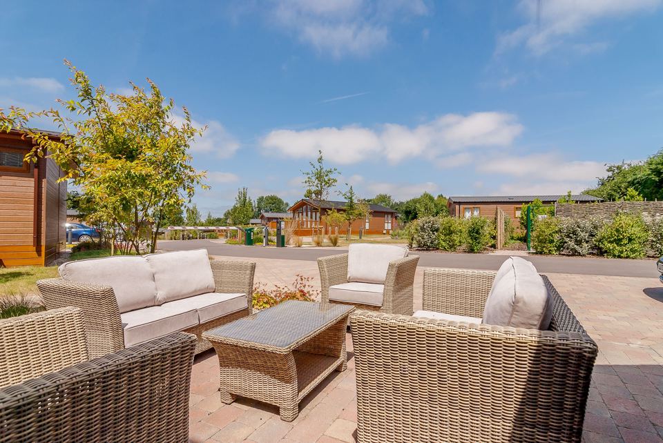 Patio seating beside the lodges