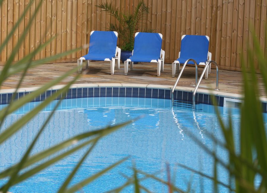 Outdoor pool with loungers